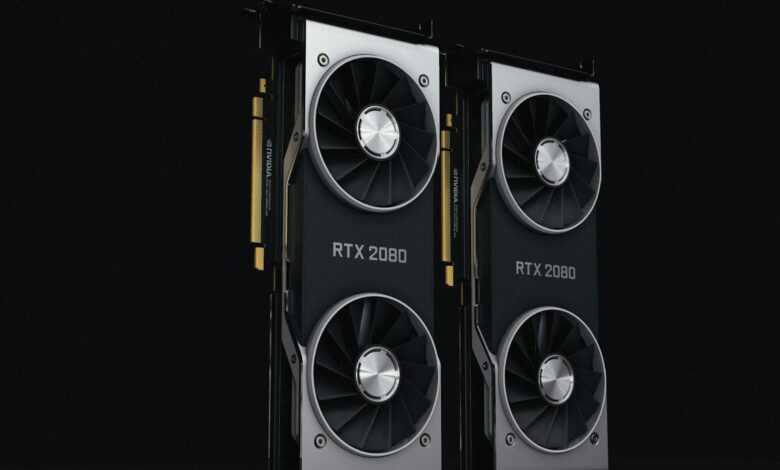 a pair of black and silver graphics cards