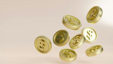 A bunch of gold buttons flying in the air