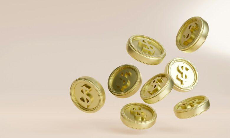 A bunch of gold buttons flying in the air