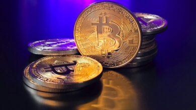 a pile of bitcoins sitting on top of a table