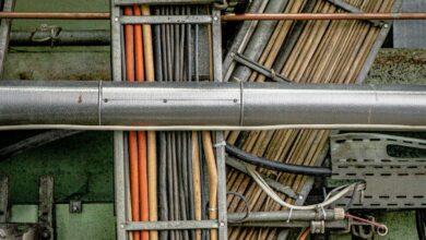 a close up of pipes and wires in a building