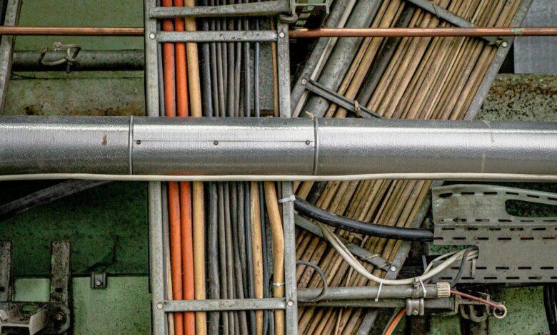a close up of pipes and wires in a building